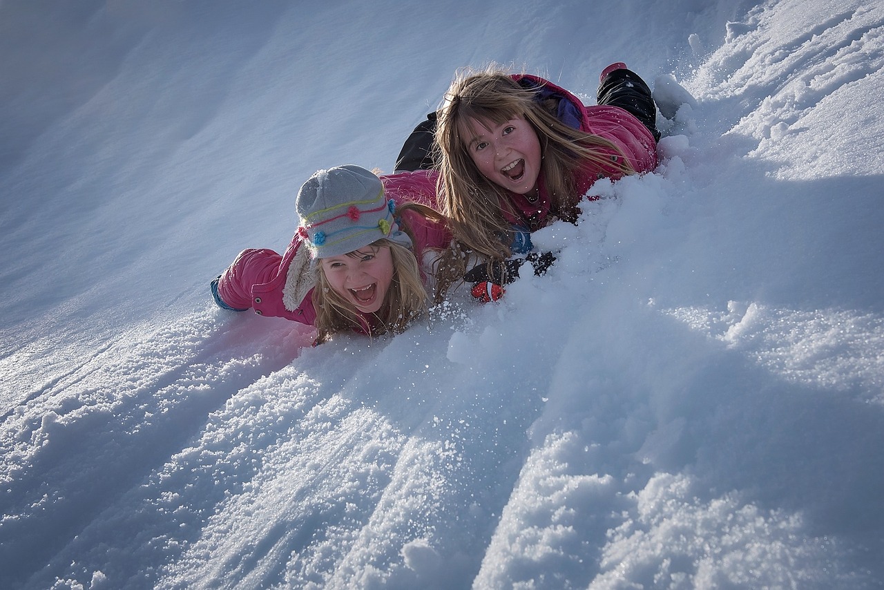 Enjoy winter in the NW Suburbs both indoors and outdoors. These sledding children show the fun of winter activities.